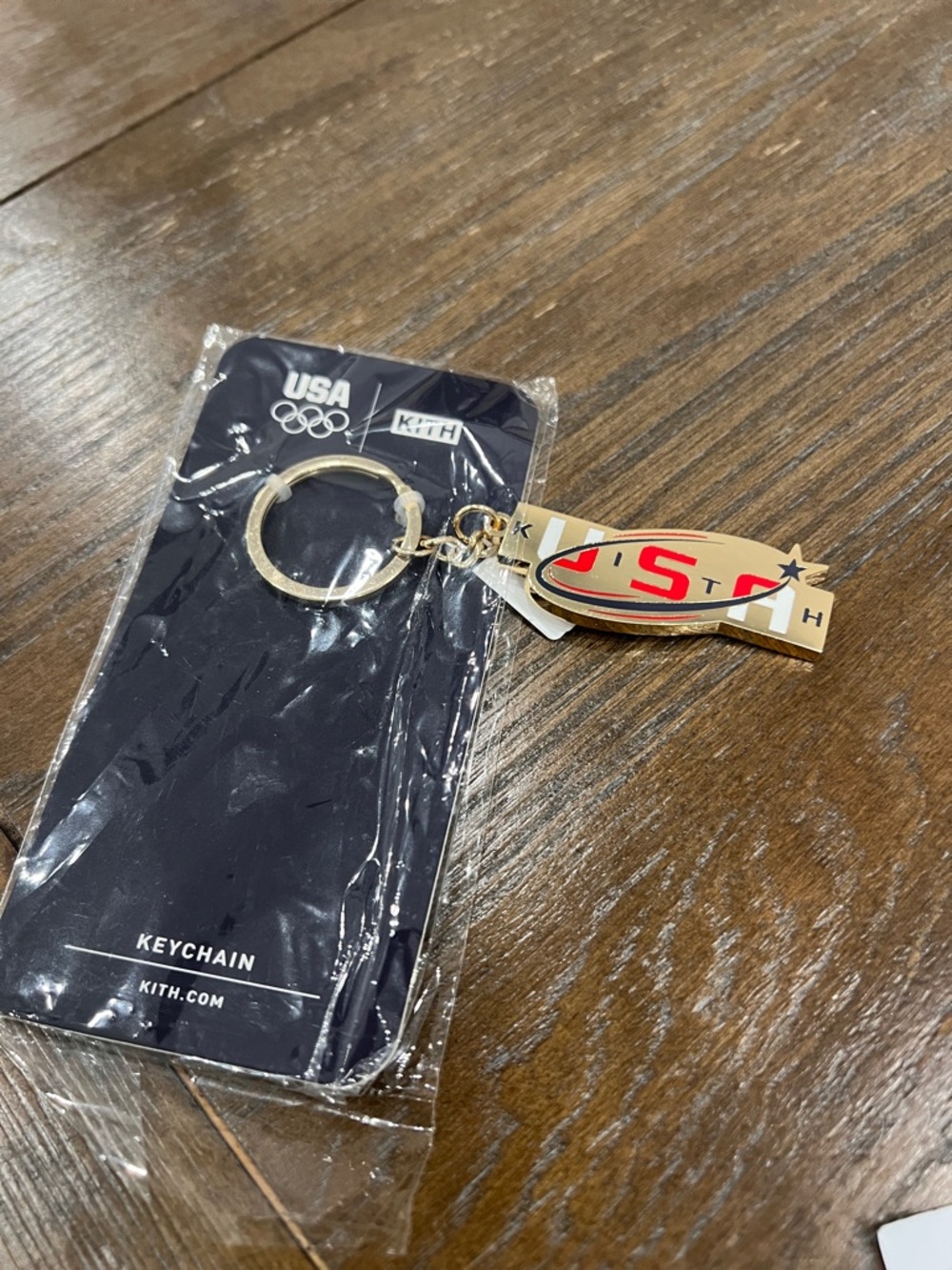Kith Gold Tone USA Enamel Keychain with Red and White Detail